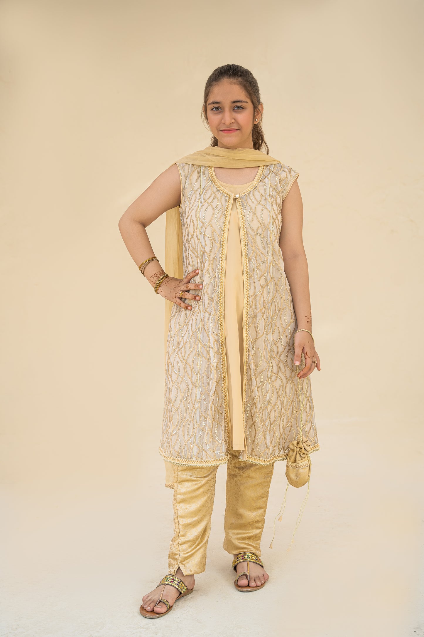 4 - piece embroidered Kameez Suit with Dupatta and Batwa.