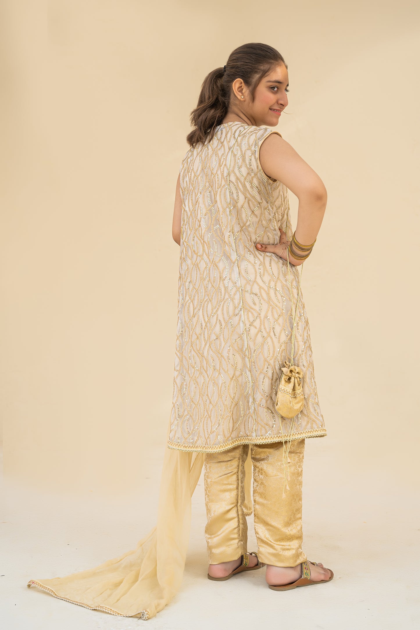 4 - piece embroidered Kameez Suit with Dupatta and Batwa.